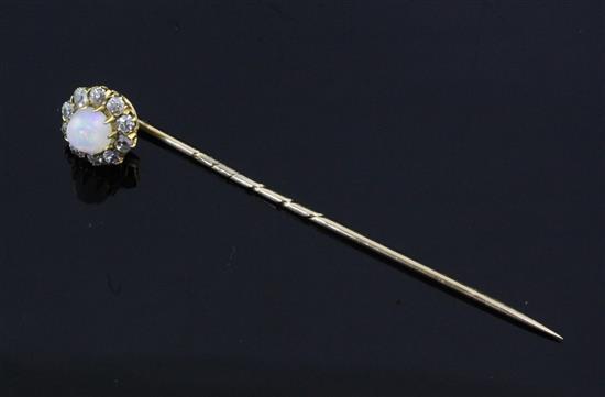 An early 20th century gold, white opal and diamond cluster stick pin, 2.25in.